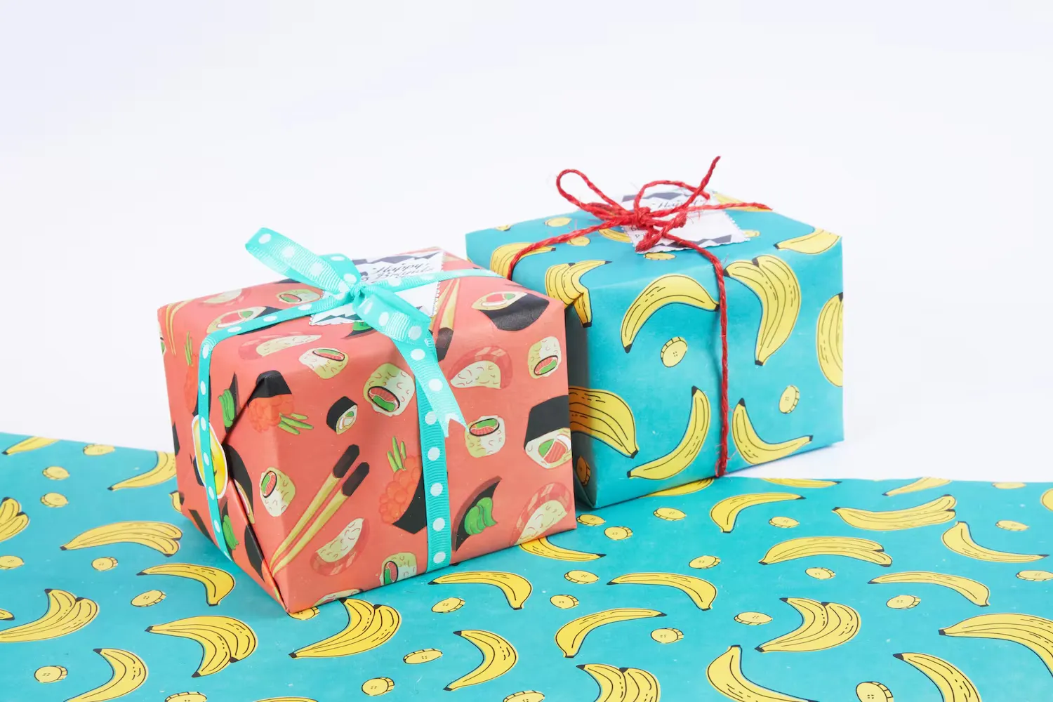 Two packages wrapped in brightly colored wrapping paper